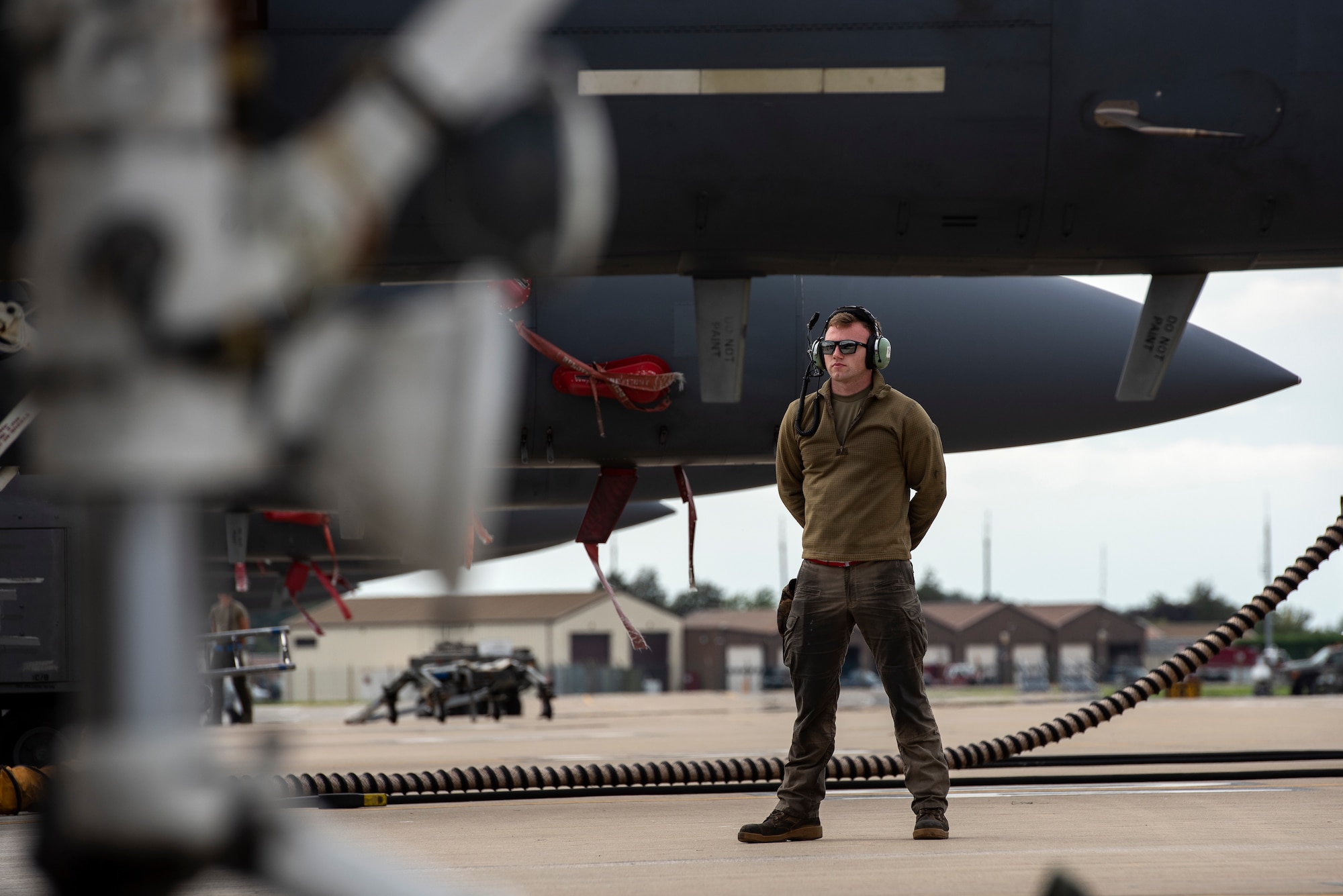 A U.S Air Force crew chief, assigned to the 494th Fighter Squadron, prepares for aircraft recovery after a training sortie at Royal Air Force Lakenheath, England, Sept. 2, 2020. The Liberty Wing is dedicated to maintaining combat readiness through daily training in order to safeguard U.S. national interests and those of NATO Allies and partners. (U.S. Air Force photo by Airman 1st Class Jessi Monte)