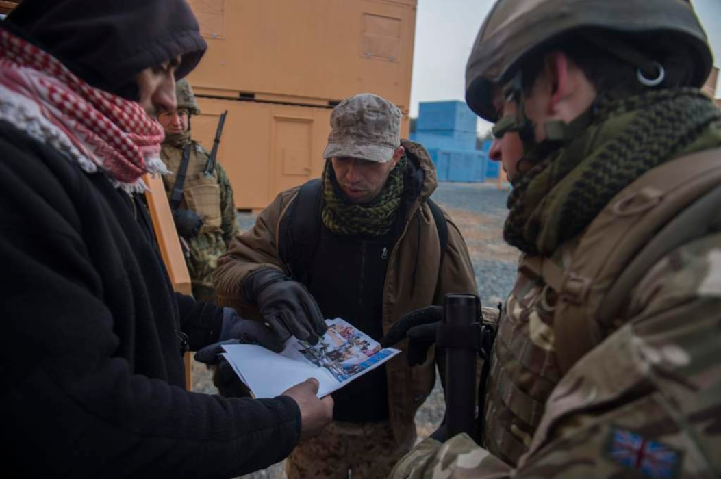 Marine Corps Information Operations Center (MCIOC), conducts training for Military Information Support Operations (MISO), at MOUT site, Quantico, Va., Feb. 11, 2014. MISO was training with actors to prepare personnel to complete future missions. (U.S. Marine Corps photo by Lance Cpl. Alexander Norred/Released)