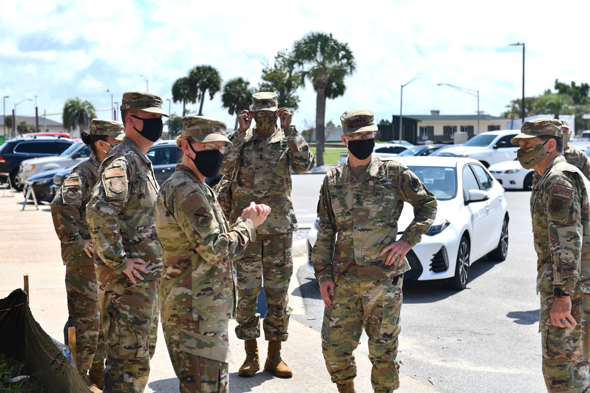 U.S. Army Lt. Gen. Ronald J. Place (second from the right), Defense Health Agency director, greets 325th and 96th Medical Group leadership at Tyndall Air Force Base, Florida, Aug. 31, 2020. Place met with 325th Fighter Wing, 325th MDG and 96th MDG leaders to discuss the current and future partnership with DHA and Tyndall’s rebuild progress. (U.S. Air Force photo by Senior Airman Stefan Alvarez)
