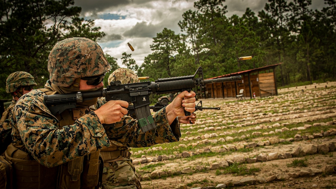 A U.S. Marine fires an M4 carbine during a joint service range in Zambrano, Honduras, Aug. 26.