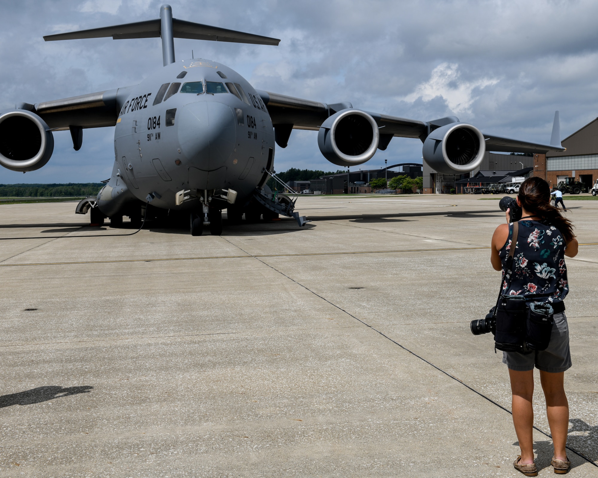 A reporter from the Pittsburgh Post Gazette photographs a 911th Airlift Wing C-17 Globemaster III parked on Youngstown Air Reserve Station’s flightline, Sept. 2, 2020. The media event was held to help spread awareness of Pittsburgh Air Reserve Station’s C-17s utilizing Mahoning Valley airspace and Youngstown-Warren Regional Airport’s runways for flight training.