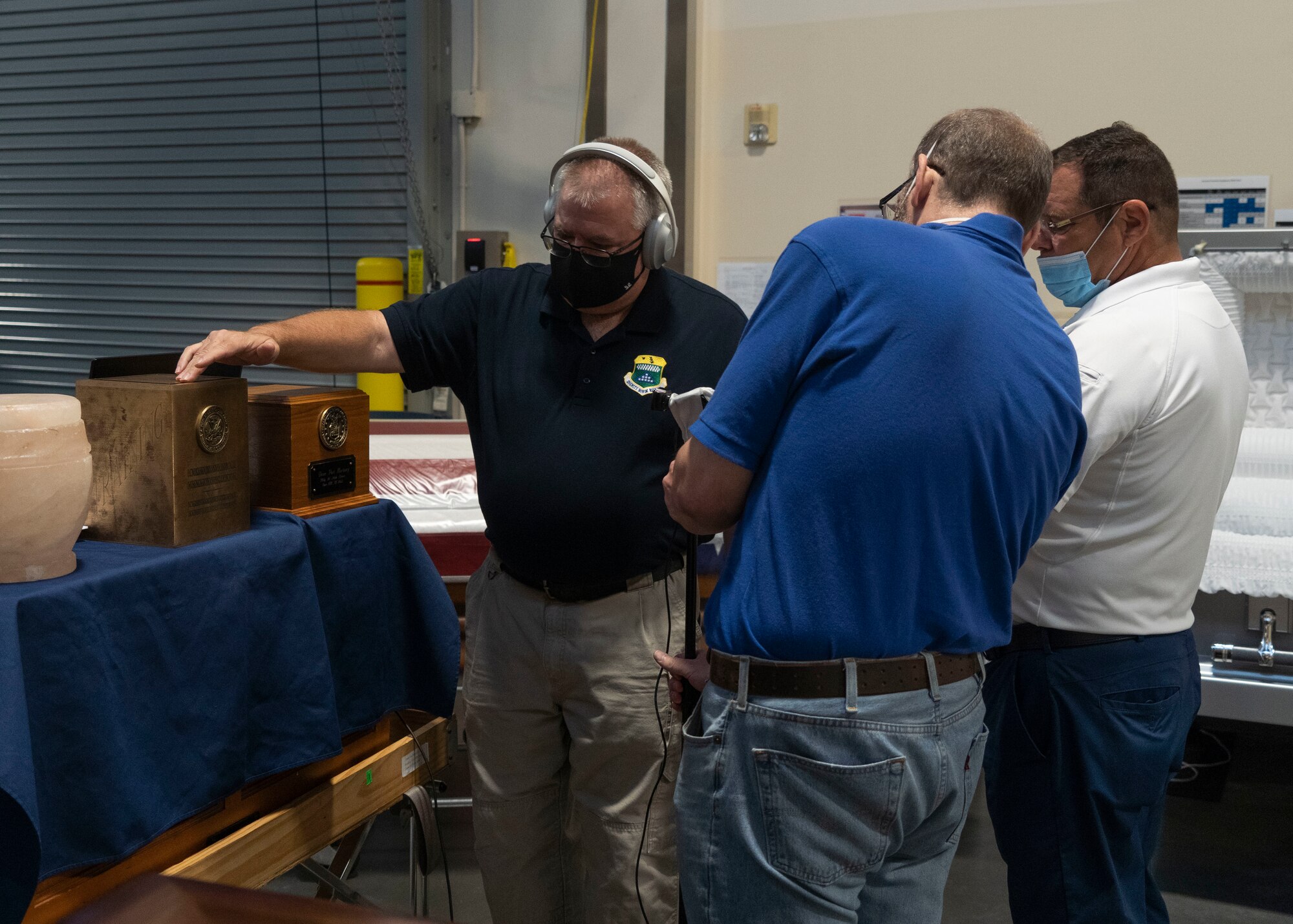 Air Force Mortuary Affairs Operations mortuary specialists, explain the different urn and casket options during the virtual Mortuary Technicians and Officers courses at Dover Air Force Base, Delaware, Aug. 5, 2020. (U.S. Air Force photo by Senior Airman Alyssa Day)