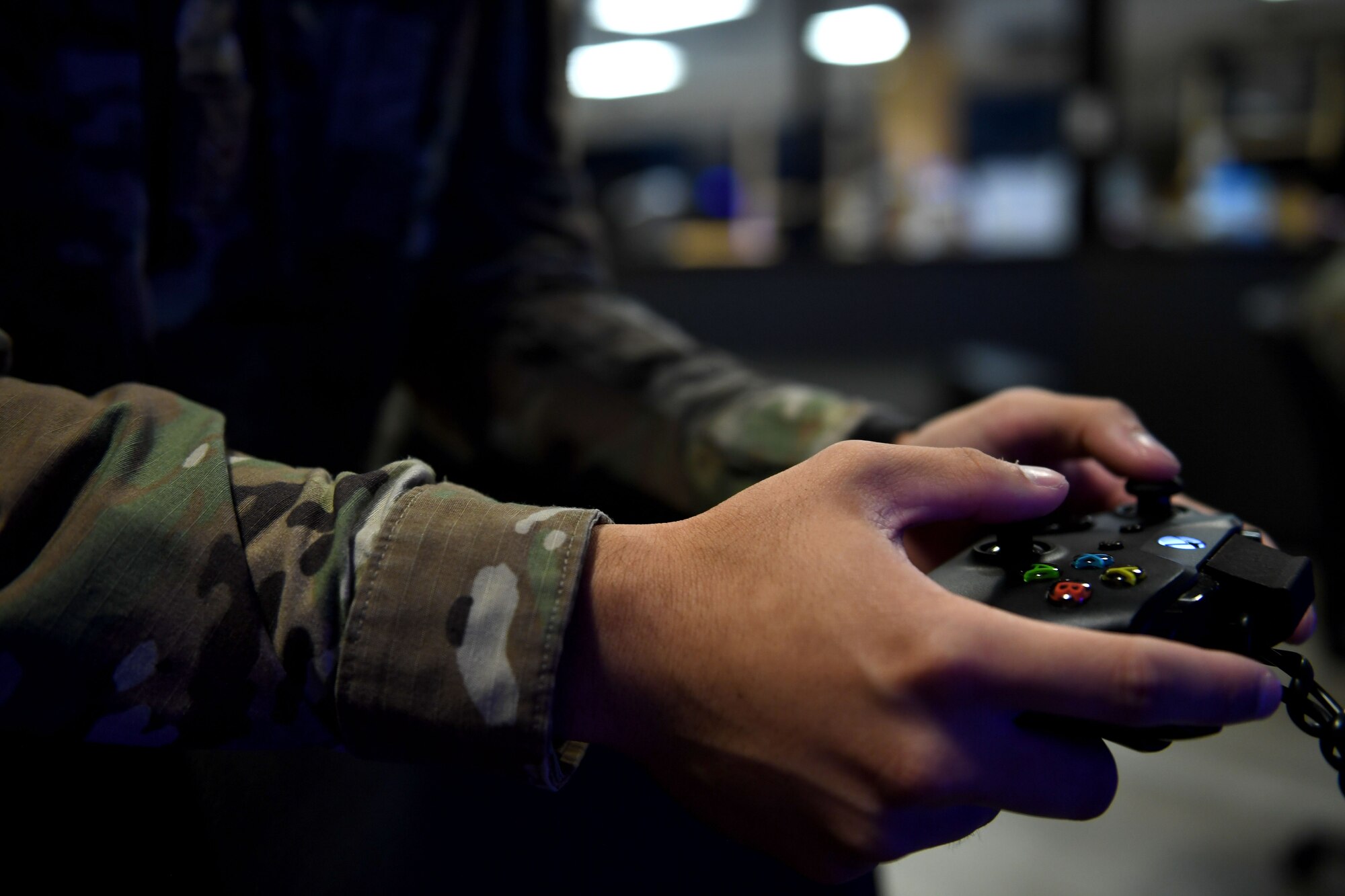 An Airman plays video games.