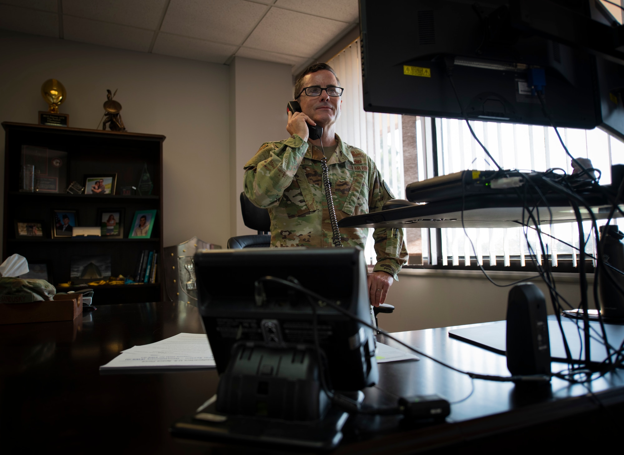 Lt. Col. Charles Sandusky, Space Delta 2 deputy commander, listens during a teleconference with Maj. Gen. DeAnna Burt, U. S. Space Force director of operations and communications, as the USSF presents the Electro-Optical Infrared Weather System – Geostationary for operational acceptance and combatant command presentation to U. S. Space Command at Peterson Air Force Base, Colorado, Sept. 1, 2020. The EWS-G system collects weather imagery to enable fielded forces to perform environmental reconnaissance and cloud characterization over the Indian Ocean region. EWS-G is a component of the Family of Systems comprising space and terrestrial environmental monitoring assets in the Space-Based Environmental Enterprise portfolio. On Sept. 1, 2020, the USSF also declared Initial Operational Capability for the system. (U.S. Air Force photo by Airman 1st Class Andrew Bertain)