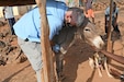 U.S. Army Reserve Maj. (Dr.) Mark Cunningham, 443rd Civil Affairs Battalion Functional Specialty Team (FXSP) preventive medicine veterinarian, in support of Combined Joint Task Force – Horn of Africa (CJTF-HOA), examines a donkey with a stethoscope during a veterinary exchange in the rural village of Ali Oune, Djibouti, August 30, 2020. In partnership with the Djiboutian Ministry of Agriculture, Livestock, and Fisheries, the 443rd CA BN was able to assist the veterinarian for Damerjog, Djibouti, in providing livestock care for the people in the remote desert village.