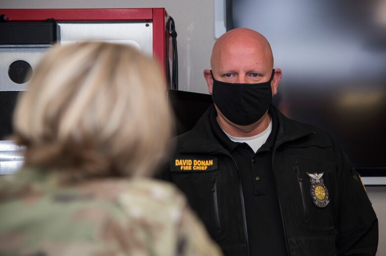 David Donan, 673d Civil Engineer Squadron fire chief, explains how the Joint Base Elmendorf-Richardson Fire and Emergency Services Flight support the 673d Air Base Wing during an immersion tour at JBER, Alaska, Aug. 28, 2020. U.S. Air Force Col. Kirsten Aguilar, JBER and 673d ABW commander, focused on the 673d CES Airmen and their role in supporting the joint base partnership on the installation in her tour.