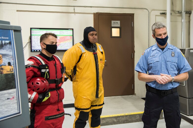 From right, 673d Civil Engineer Squadron firefighters Timothy Gonyea, U.S. Air Force Senior Airmen Uhila Afungia and Jacob Timmer, explain swift water and ice water rescue services to U.S. Air Force Col. Kirsten Aguilar, Joint Base Elmendorf-Richardson and 673d Air Base Wing commander during an immersion tour at JBER, Alaska, Aug. 28, 2020. Aguilar’s tour focused on the 673d CES Airmen and their role in supporting the joint base partnership on the installation.