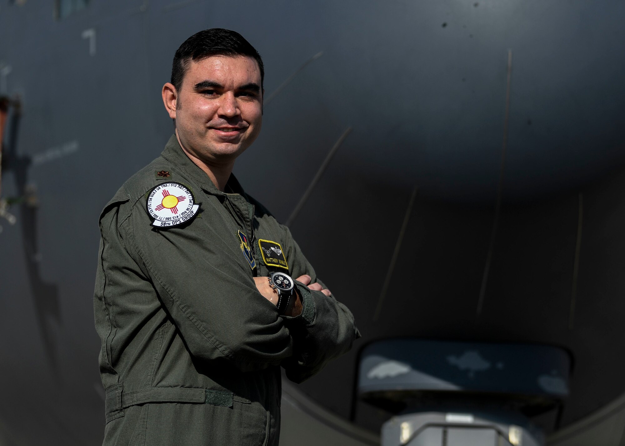 Maj. Matthew Single poses in front of a C-130J