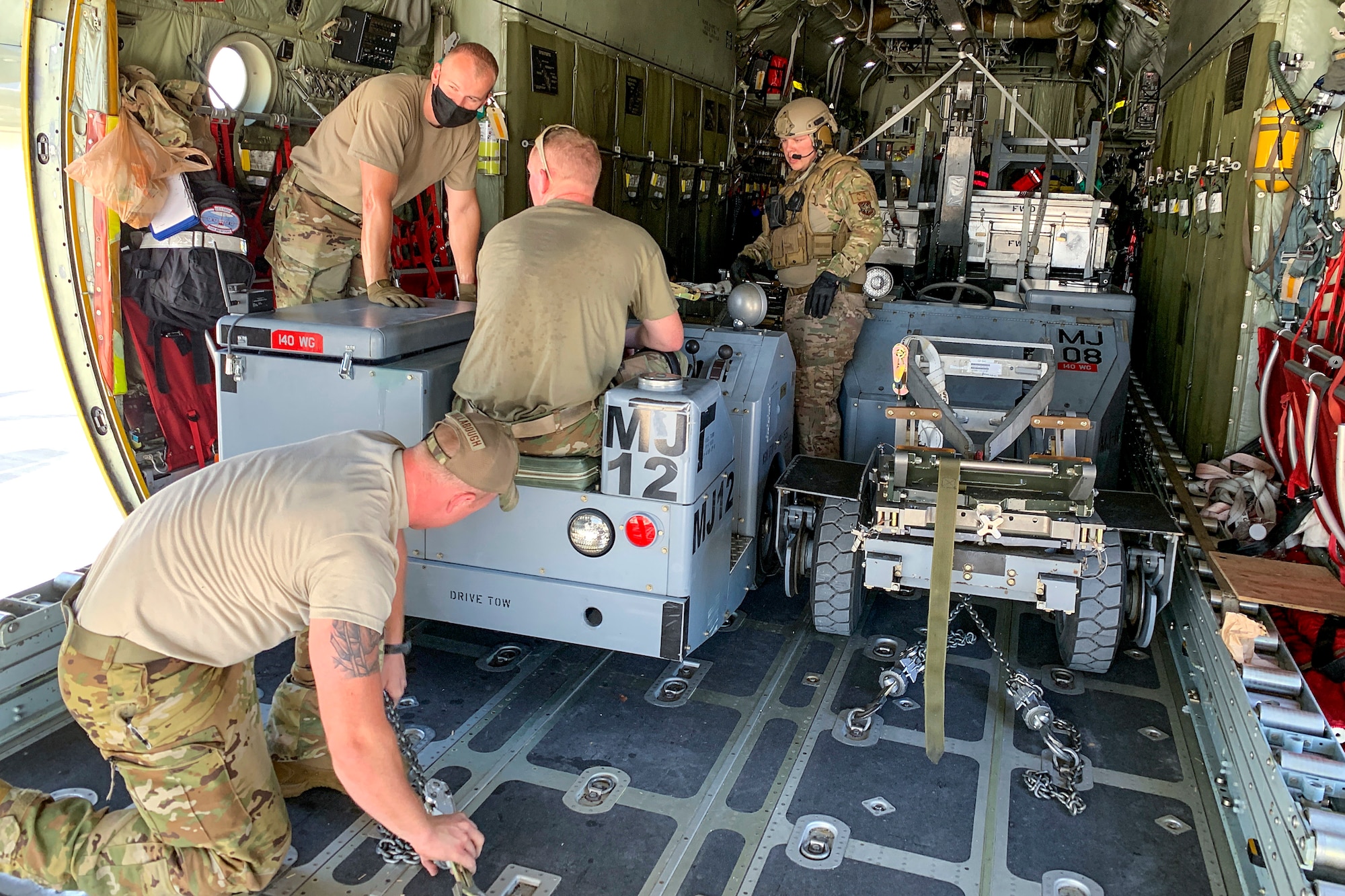 U.S. Air Force Airmen prepare to offload a weapon-loading jammer from a 109th Airlift Wing LC-130 Hercules aircraft Sept. 3, 2020, at Nellis Air Force Base, Nevada. Airmen participated in the Advanced Battle Management Onramp #2 exercise as a continuation of the Agile Combat Employment concept and to test the state-of-the-art ABMS, which is designed to enable combatant commanders the ability to control Department of Defense assets in real time. (Courtesy photo)