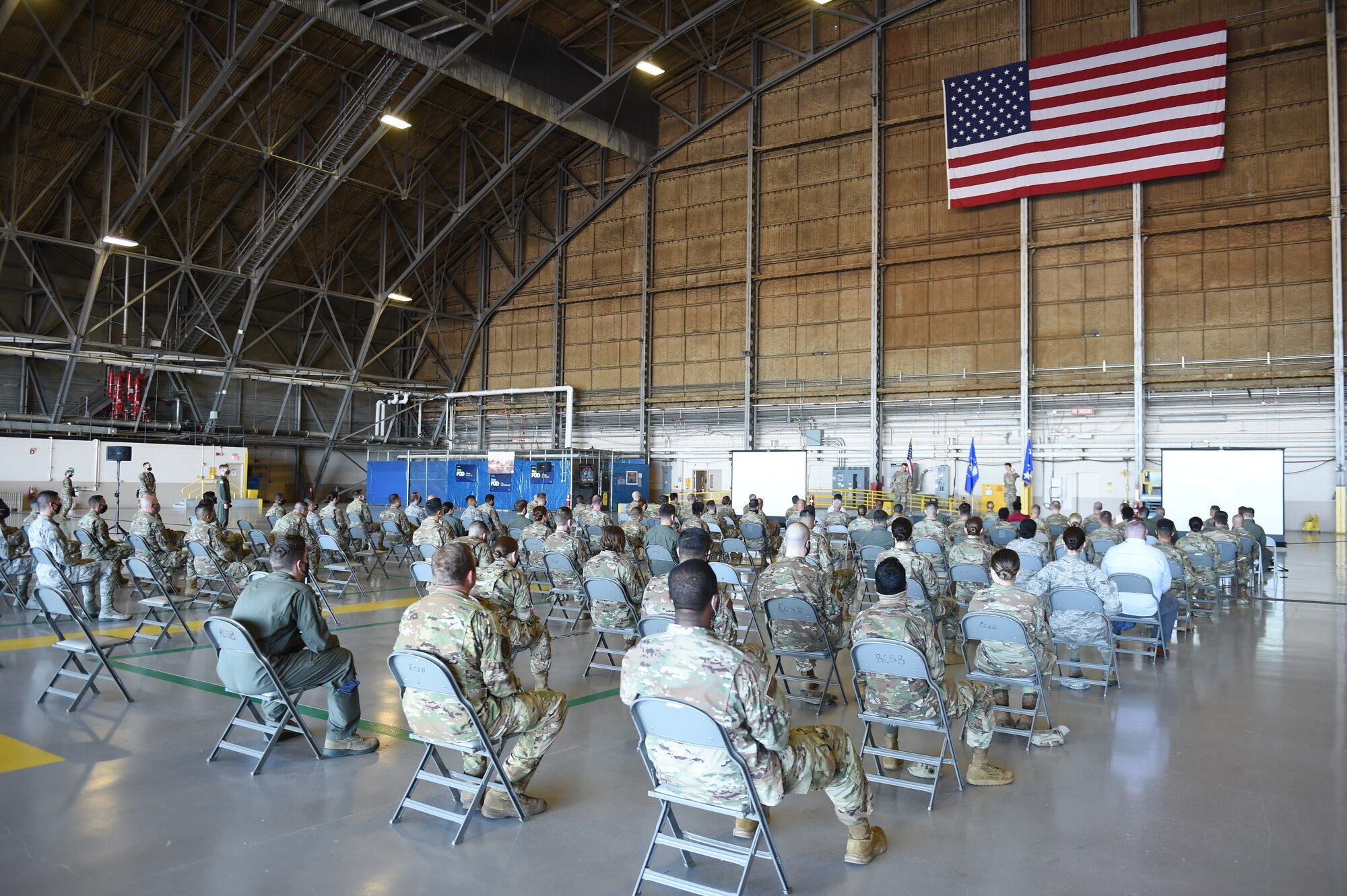 Gen. Jacqueline Van Ovost, Air Mobility Command commander, and Chief Master Sgt. Brian Kru-zelnick, AMC command chief, hold a socially-distanced all call for members of Team McChord on Joint Base Lewis-McChord, Wash., Sept. 3, 2020. AMC leadership is currently touring bases as part of their listening tour to learn from AMC Airmen. (U.S. Air Force photo by Airman 1st Class Mikayla Heineck)