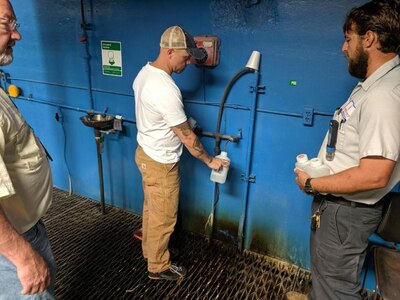 Michael Brown, Public Health Command-Pacific senior environmental engineer, collects a treated water sample from the water treatment plant at Fort Polk, La., April 9, 2019. The sample was analyzed for multiple contaminants that contribute to drinking water discoloration at the Army Public Health Center laboratory. (U.S. Army photo by Capt. Charles Bateman)