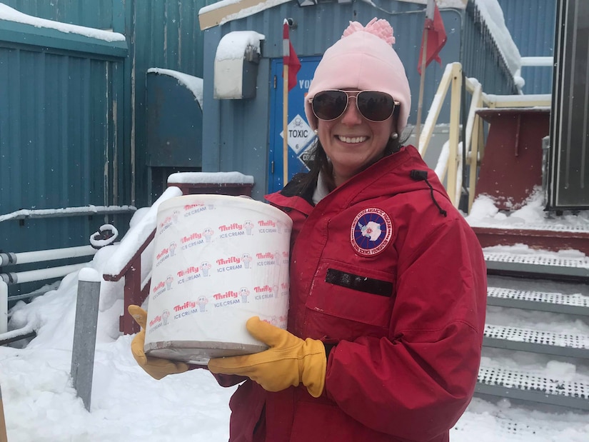 Capt. Austin Leedy, veterinary food safety officer from Public Health Activity-San Diego, carries a container of ice cream out of a shipping container at Palmer Station, Antarctica, October 2019. U.S. Army Public Health Command-Pacific veterinary food safety officers partner with the National Science Foundation to ensure Palmer Station has a safe food supply and to perform independent food inspections throughout the entire annual resupply process. (Courtesy photo)