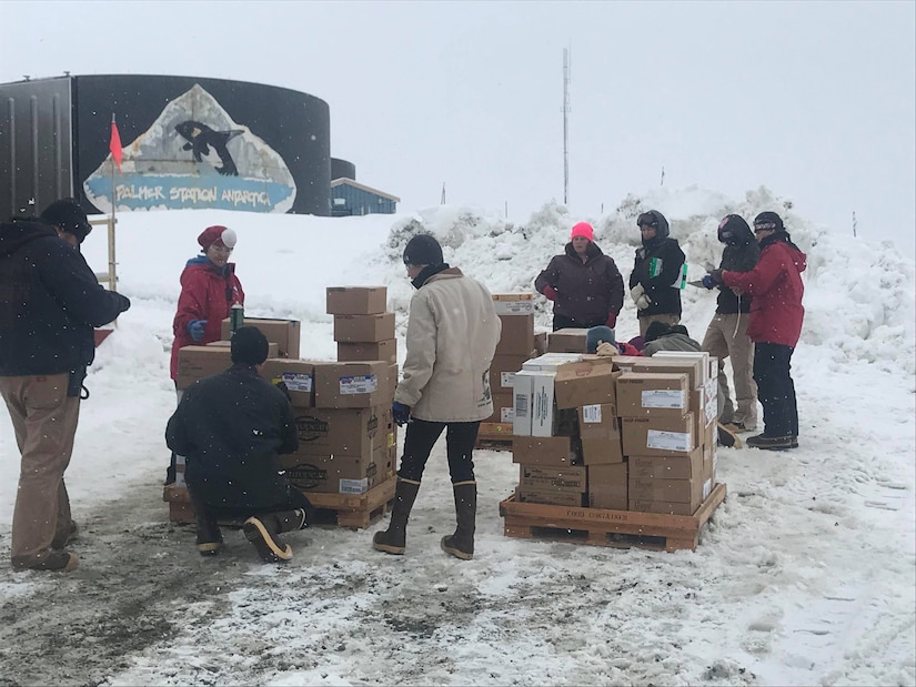 Members of the National Science Foundation inventory boxes of frozen foods at Palmer Station, Antarctica, October 2019. The boxes of food were inspected by U.S. Army Public Health Command-Pacific veterinary food safety officers to ensure the food was safe to eat and that no one would get sick from foodborne illnesses. (U.S. Army photo by Capt. Austin Leedy)