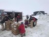 Members of the National Science Foundation unload shipping containers and inventory the boxes of frozen food at Palmer Station, Antarctica, October 2019. The boxes of food were part of an annual resupply process for the station. Each box was inspected by U.S. Army Public Health Command-Pacific veterinary food safety officers to ensure the food was safe to eat and that no one would get sick from foodborne illnesses. (U.S. Army photo by Capt. Austin Leedy)
