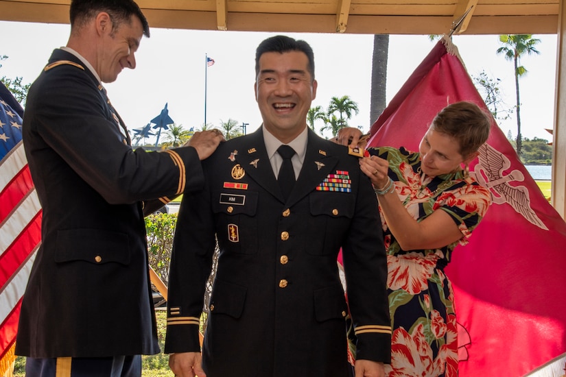 Col. Ronald Burke, Public Health Command-Pacific deputy commander, and Mirka Kim, wife of Lt. Col. Hee Kim, Public Health Command-Pacific chief of Operations, pins on the rank of lieutenant colonel to Hee Kim during his promotion ceremony at Joint Base Pearl Harbor-Hickam, Hawaii, Jan. 24, 2020. Kim represents one of 59 active duty Entomology officers currently serving in the U.S. Army. (U.S. Army photo by Amber E. Kurka)