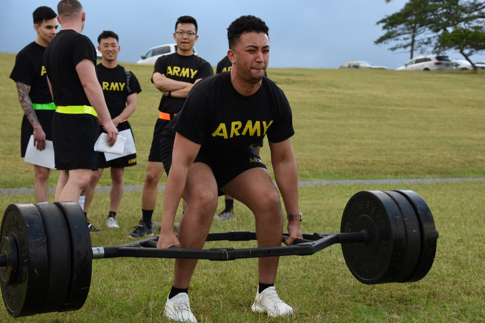 A  Soldier, from Public Health Activity – San Diego, lifts weights during the deadlift event of the Army Combat Fitness Test at Tripler Army Medical Center, Hawaii, March 2, 2019. This week, Public Health Command – Pacific and Dental Health Command – Pacific are holding their Best Warrior Competitions together. Some of the specific tasks Soldiers will complete this week include: an Army Combat Fitness Test assessment, a land navigation course, Army Warrior tasks, an obstacle course, a formal board interview, and a mystery event. The PHC-P winners will be announced Friday during an award ceremony. (U.S. Army photo by Amber Kurka)