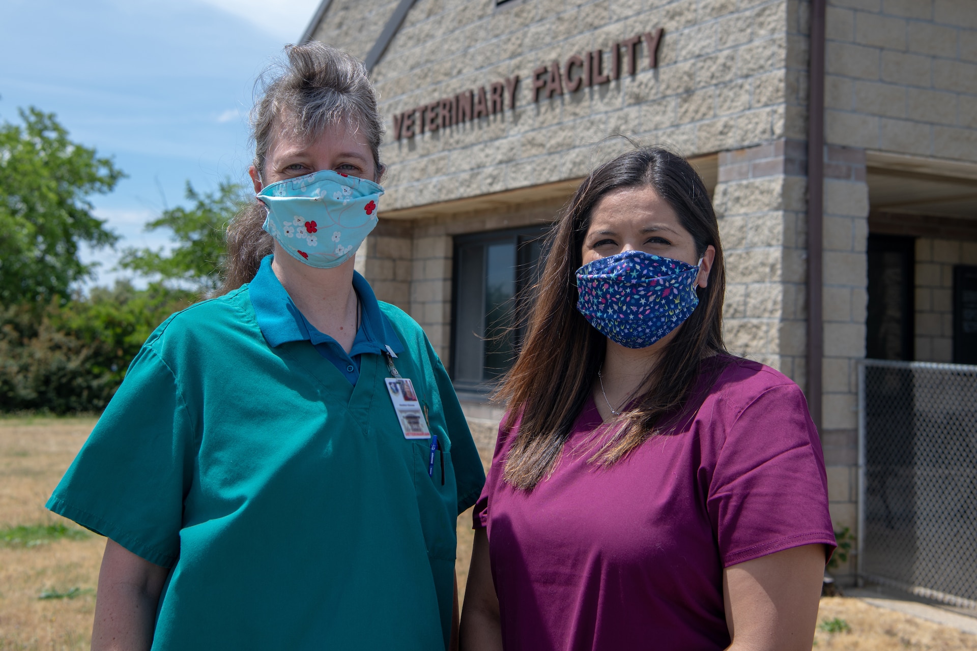 Dr. Heather Graves and Virginia Prieto, both employees at the Beale Veterinary Treatment Facility, stand together in front of the facility, on Beale Air Force Base, California, May 15, 2020. Graves and Prieto helped save a local family from rabies after noticing a social media post about a native Mexican free-tailed bat that was found by one of the family’s dogs. Prieto responded to the post and Graves got Animal Control involved. Together they helped the family get medical assistance and prevented the spread of rabies to the family. (U.S. Air Force photo by Staff Sgt. Ramon A. Adelan)