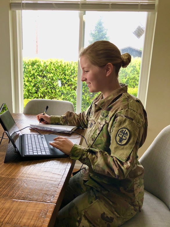 Capt. Galina Pate, a U.S. Army Veterinary Corps First-Year Graduate Veterinary Education program intern with Public Health Activity-Fort Lewis, presents a capstone project to members of Public Health Command-Pacific May, 14, 2020, from her home in Washington. For the last year Petersen and three other FYGVE interns from PHA-FL developed a comprehensive capstone project as part of their yearlong internship.  Their project focused on the One Health concept, and how human health care providers can help save the lives of military working dogs downrange. (Courtesy image)