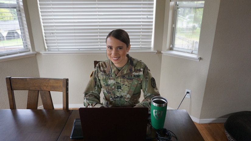 Capt. Christina Petersen, a U.S. Army Veterinary Corps First-Year Graduate Veterinary Education program intern with Public Health Activity-Fort Lewis, presents a virtual capstone project to members of Public Health Command-Pacific, May 14, 2020, from her home in Washington. For the last year Petersen and three other FYGVE interns from PHA-FL developed a comprehensive capstone project as part of their yearlong internship.  Their project focused on the One Health concept, and how human health care providers can help save the lives of military working dogs downrange. (Courtesy image)