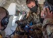 U.S. Army Capt. James Gaffney, Public Health Activity - Japan, Veterinary Treatment Facility OIC, briefs members of the 374th Security Forces Squadron and 18th Aeromedical Evacuation Squadron during a C-12J Huron, K-9 evacuation training scenario, August 20, 2020, at Yokota Air Base, Japan. Airmen assigned to the 374th SFS and 18th Aeromedical Evacuation Squadron practiced K-9 evacuation procedures and best practices. (U.S. Air Force photo by Staff Sgt. Juan Torres)