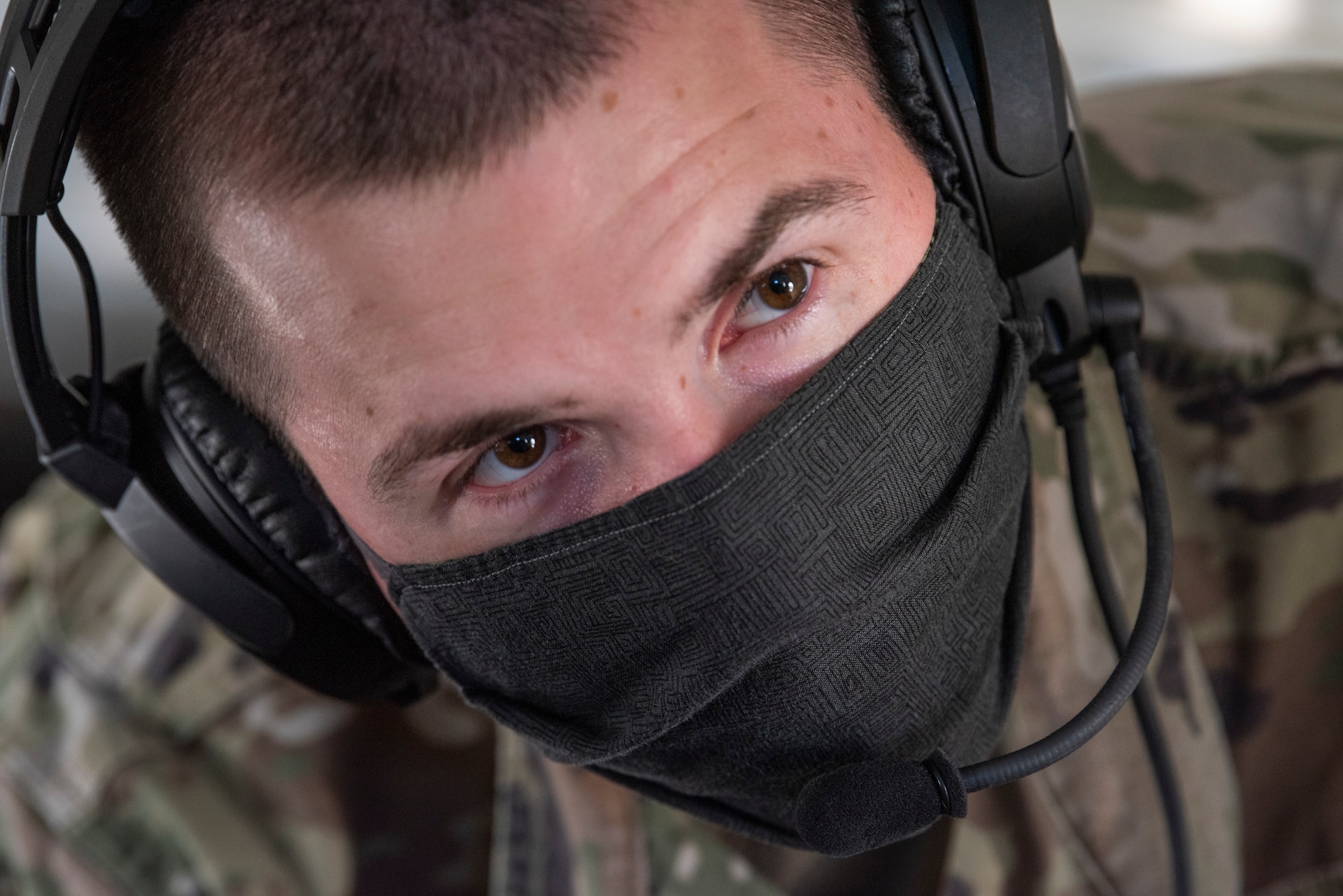 U.S. Army Capt. James Gaffney, Public Health Activity - Japan, Veterinary Treatment Facility OIC, briefs members of the 374th Security Forces Squadron and 18th Aeromedical Evacuation Squadron during a C-12J Huron, K-9 evacuation scenario, August 20, 2020, at Yokota Air Base, Japan. The training scenario provided the teams with hands-on K-9 evacuation procedures and best practices. (U.S. Air Force photo by Staff Sgt. Juan Torres)