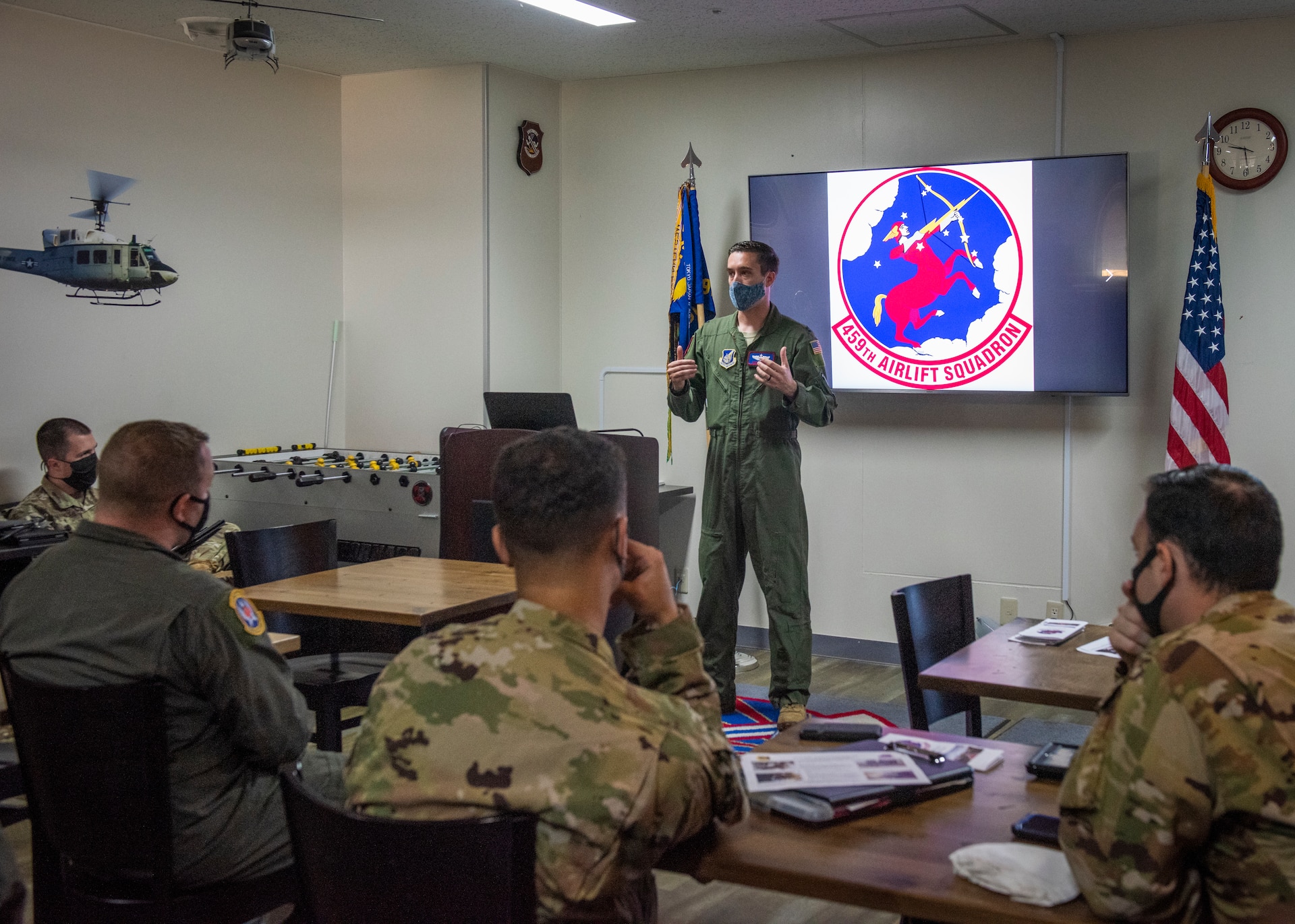 Capt. Nicholas Strobel, 459th Airlift Squadron C-12J Huron instructor pilot, briefs members of the 374th Security Forces Squadron and 18th Aeromedical Evacuation Squadron before a C-12J Huron, K-9 evacuation scenario, August 20, 2020, at Yokota Air Base, Japan. The scenario provided the teams with hands-on K-9 evacuation procedures and best practices. (U.S. Air Force photo by Staff Sgt. Juan Torres)