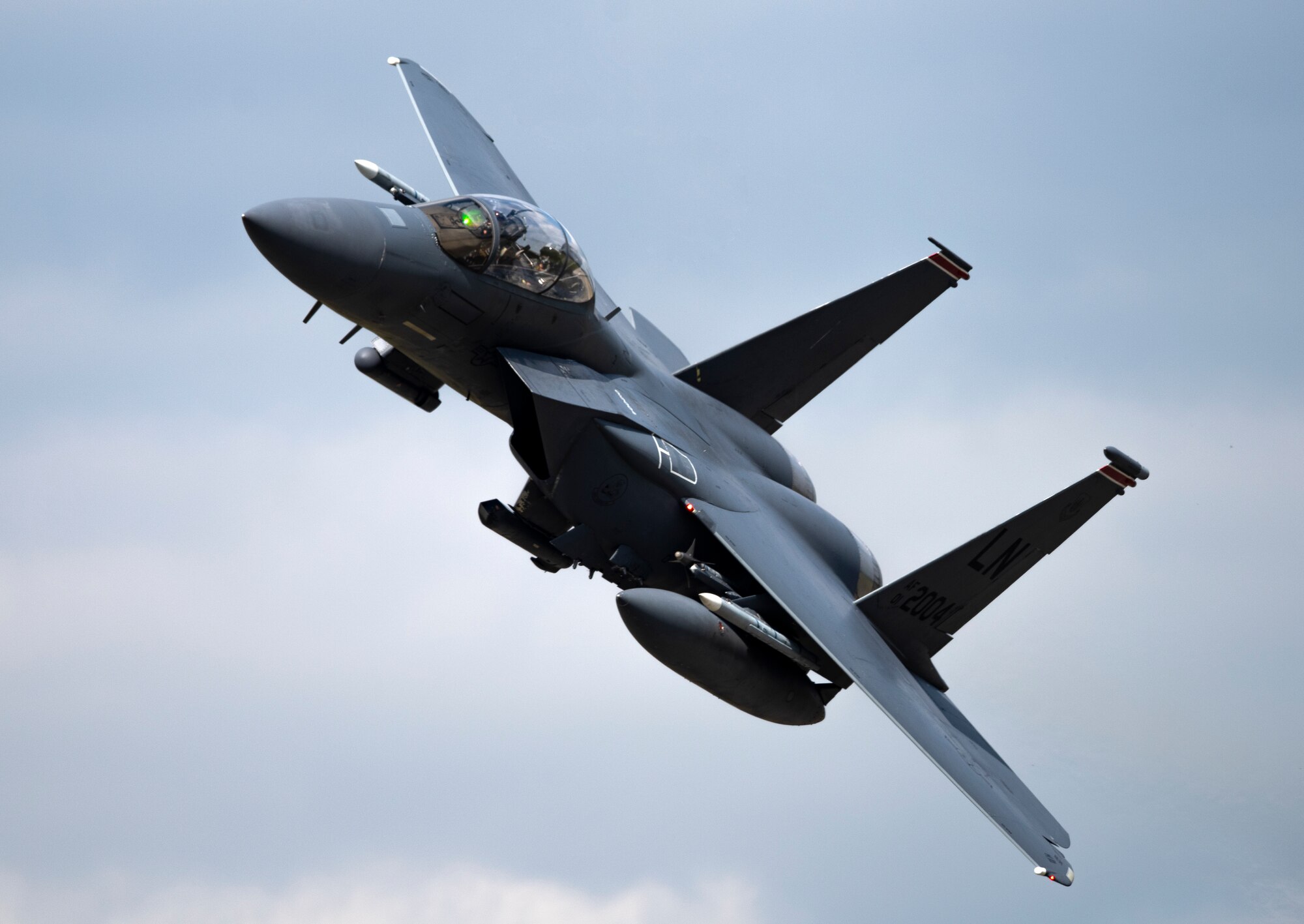 A U.S. Air Force F-15E Strike Eagle, assigned to the 494th  Fighter Squadron, flies overhead at Royal Air Force Lakenheath, England, Sept. 1, 2020. The 48th Fighter Wing conducts routine training in order to maintain combat readiness and safeguard U.S. national interests and the collective defense of allies and partners. (U.S. Air Force photo by Airman 1st Class Jessi Monte)