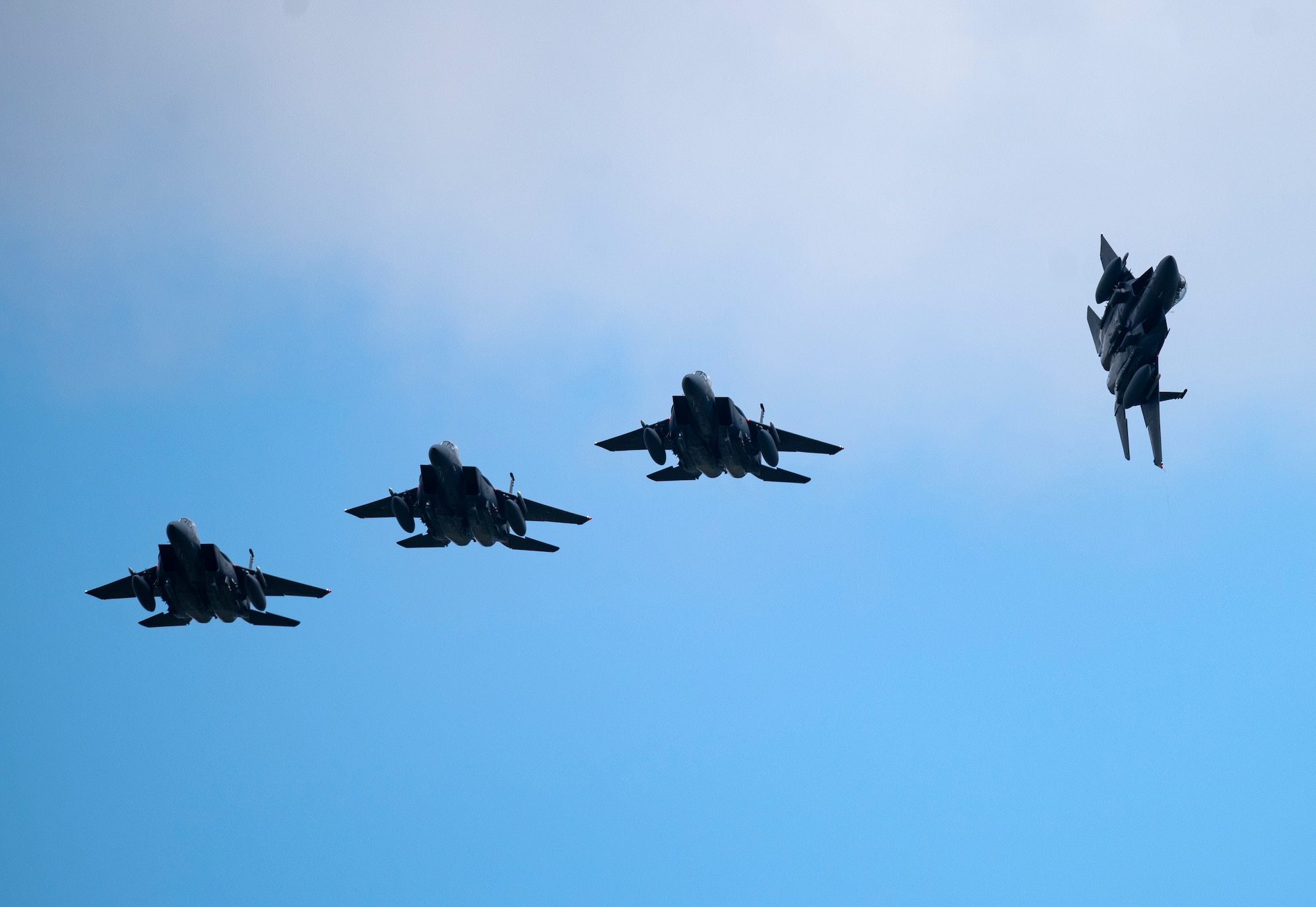 U.S. Air Force F-15E Strike Eagles, assigned to the 494th and 492nd Fighter Squadron, fly over Royal Air Force Lakenheath, England, Sept. 1, 2020. The Liberty Wing conducts routine training in order to maintain combat readiness and safeguard U.S. national interests and the collective defense of allies and partners. (U.S. Air Force photo by Airman 1st Class Jessi Monte)