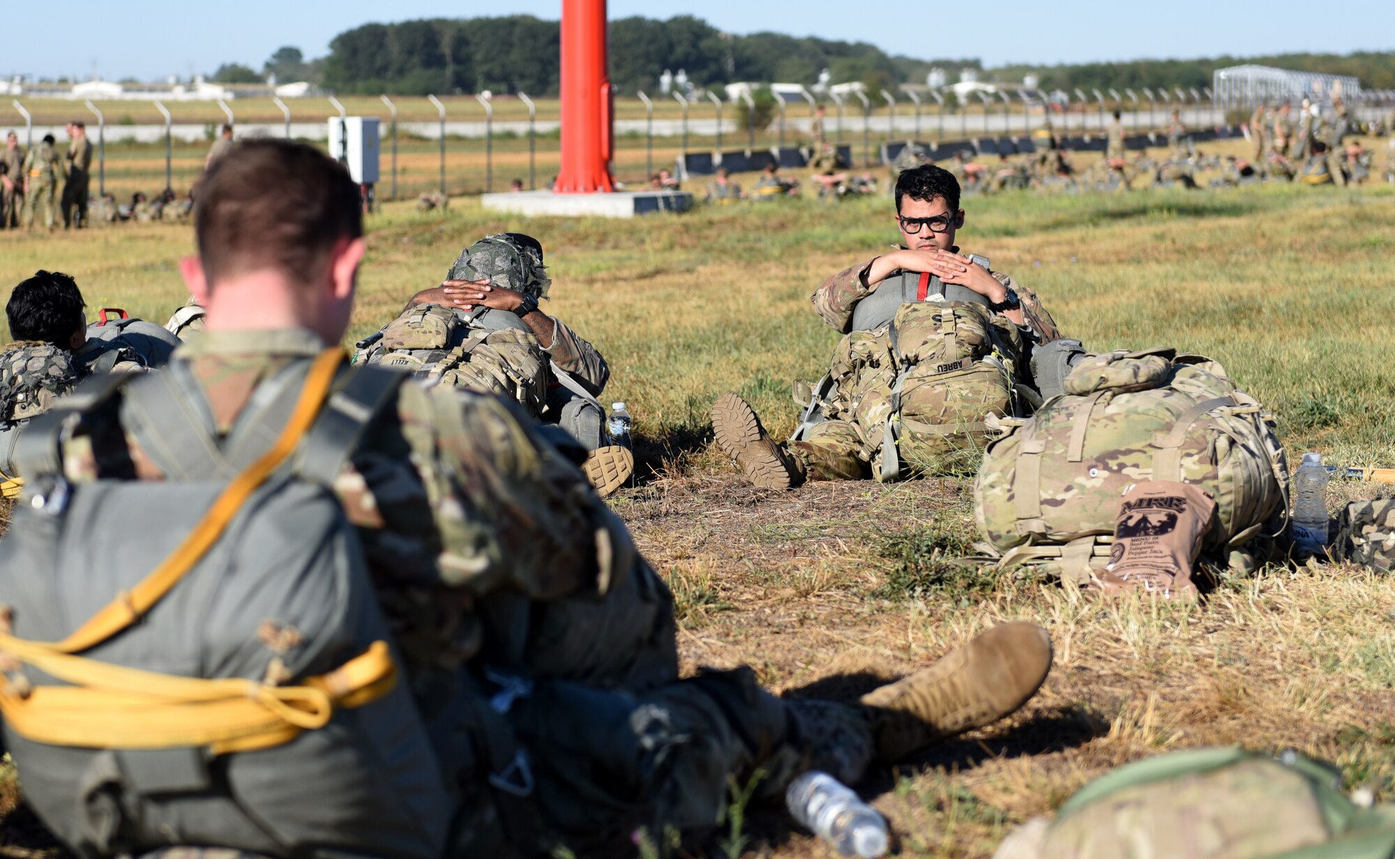 U.S. Army 1st Lieutenant Gabriel Abreu, 2nd Squadron, 91st Cavalry Regiment, 173rd Airborne Brigade assistant intelligence officer, sits among soldiers prior to participating in an exercise at Mihail Kogalniceanu Air Base, Romania, Sept. 1, 2020.