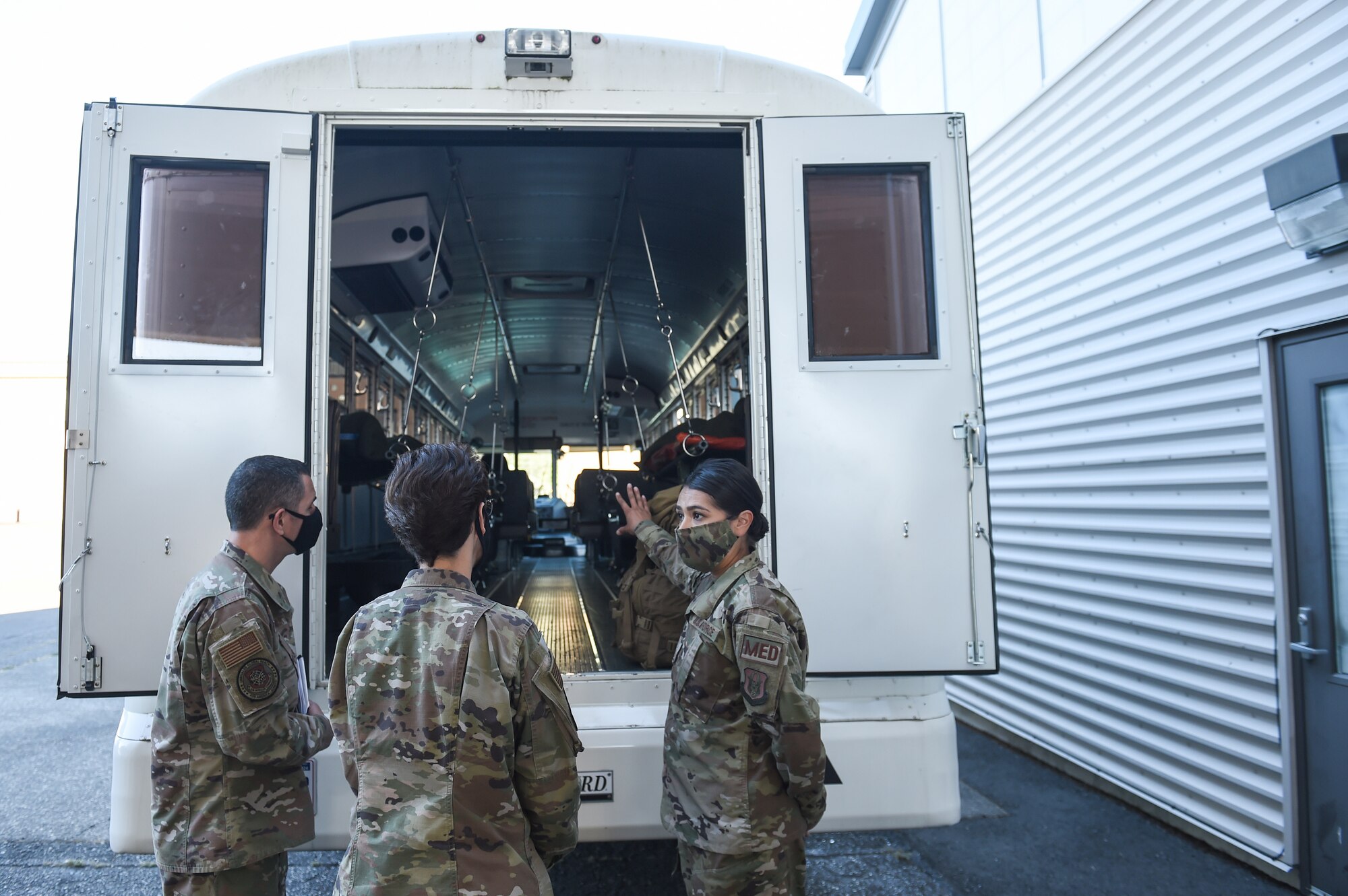 Gen. Jacqueline Van Ovost, Air Mobility Command commander, center, and Chief Master Sgt. Brian Kruzelnick, AMC command chief, left, learn about the 446th Aeromedical Staging Squadron’s mission from Master Sgt. Christina Rodriguez, 446th ASTS medical technician, during their visit at Joint Base Lewis-McChord, Wash., Sept. 3, 2020. The objective of the AMC leadership’s visit is to learn from and listen to AMC Airmen and their families. (U.S. Air Force photo by Airman 1st Class Mikayla Heineck)