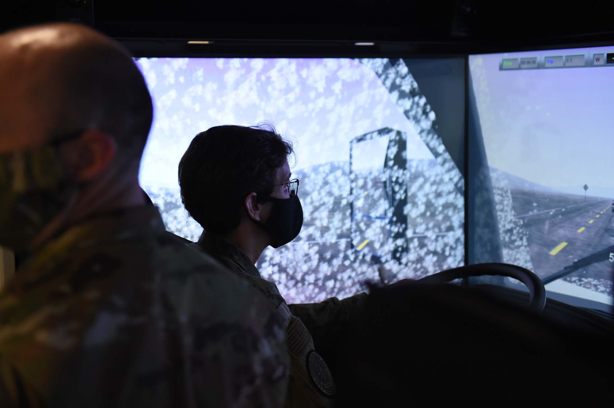 Gen. Jacqueline Van Ovost, Air Mobility Command commander, drives a large vehicle simulator at the 627th Logistic Readiness Squadron on Joint Base Lewis-McChord, Wash., Sept. 3, 2020. The driving simulator was recently purchased to increase the quality of training. (U.S. Air Force photo by Airman 1st Class Mikayla Heineck)