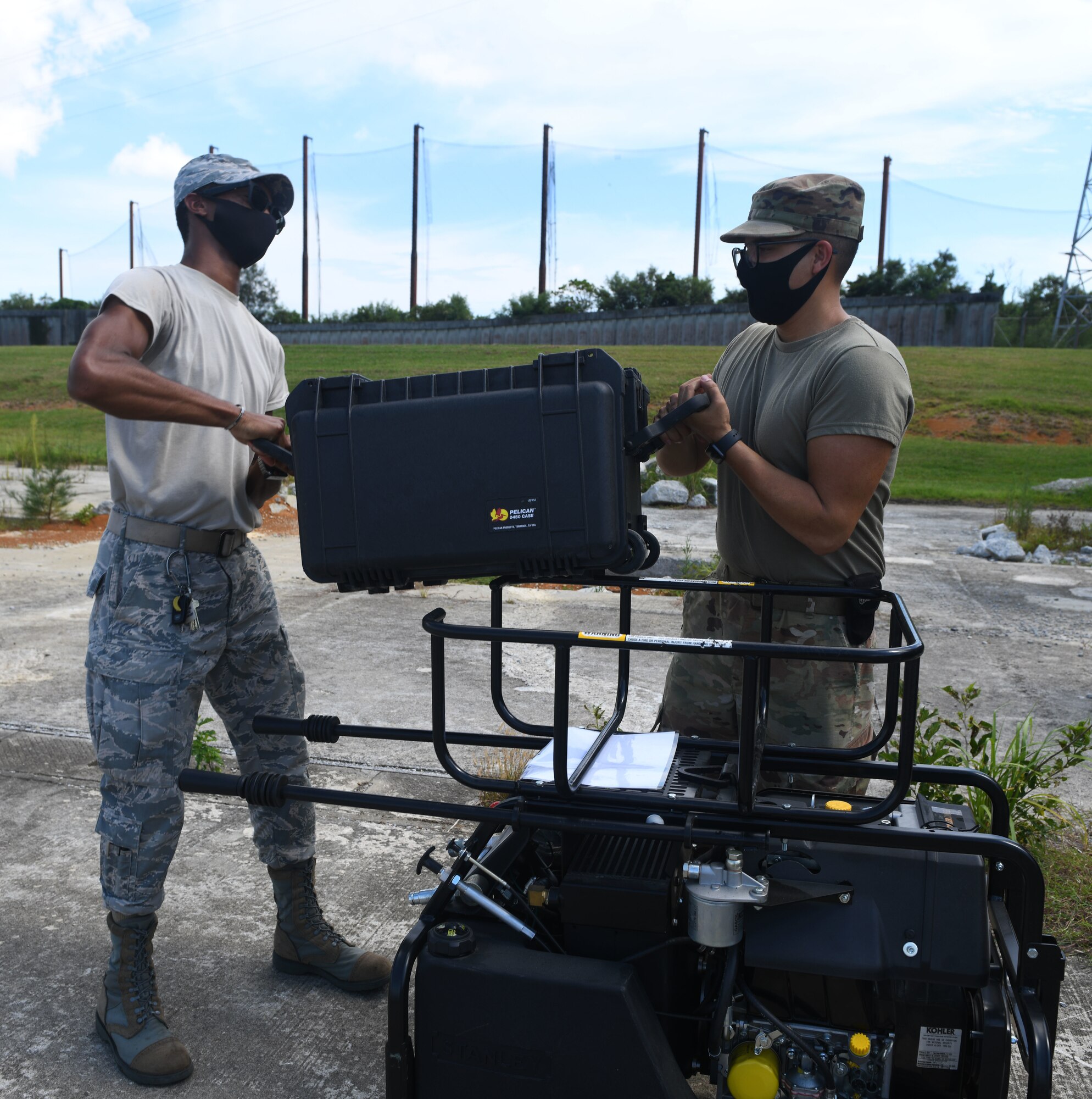 Airmen with a toolbox.