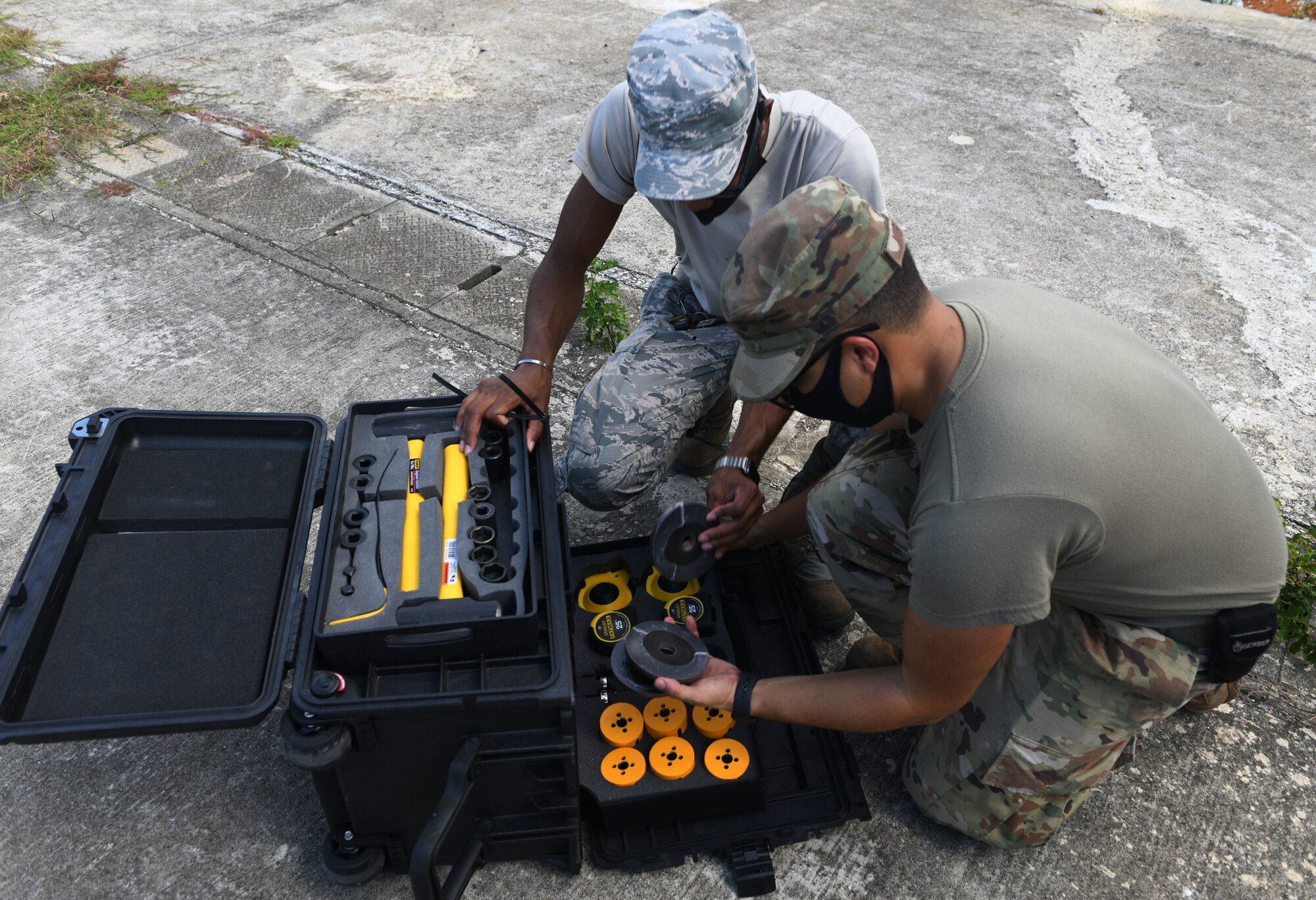 Airmen inspect a toolbox.