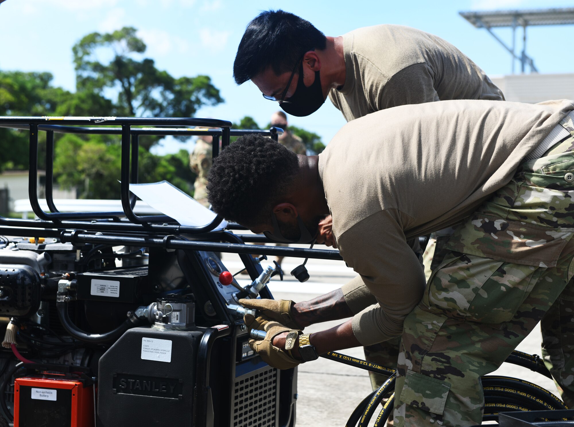 Airmen check equipment.