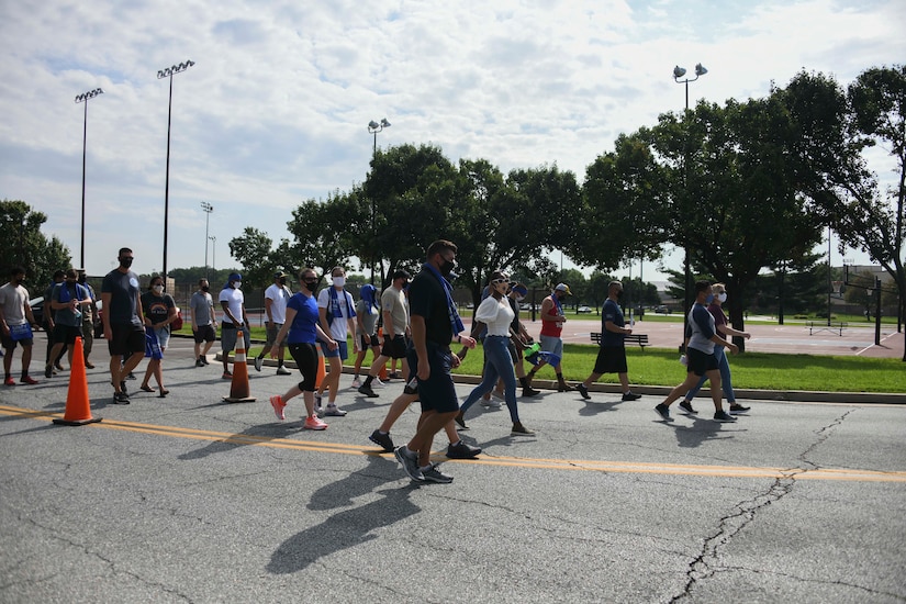 A group of walkers begin their 1.3-mile walk as part of the Joint Base Andrews Unity Festival at JBA, Md., Sept. 3, 2020. The walk was just one event during the festival intended to enhance both cross-cultural and cross-gender awareness and promote harmony amongst military members, their families and the civilian workforce. (U.S. Air Force photo by Airman 1st Class Spencer Slocum)