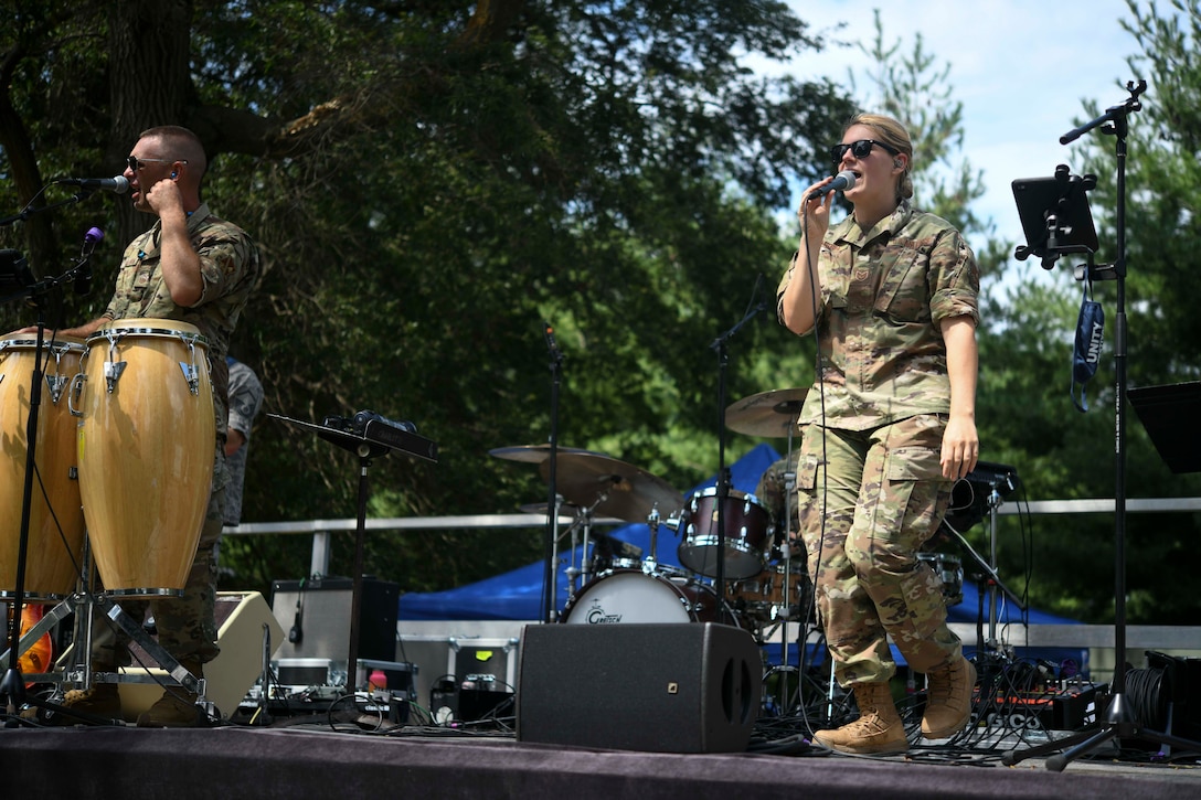 Tech. Sgt. Nadia Sosnoski, U.S. Air Force Band Singing Sergeants soprano, sings as part of the Joint Base Andrews Unity Festival at JBA, Md., Sept. 3, 2020. Sosnoski sang with Air Force Band ensemble SuperSonic as they performed following the 1.3-mile walk, to provide entertainment for attendees. (U.S. Air Force photo by Airman 1st Class Spencer Slocum)