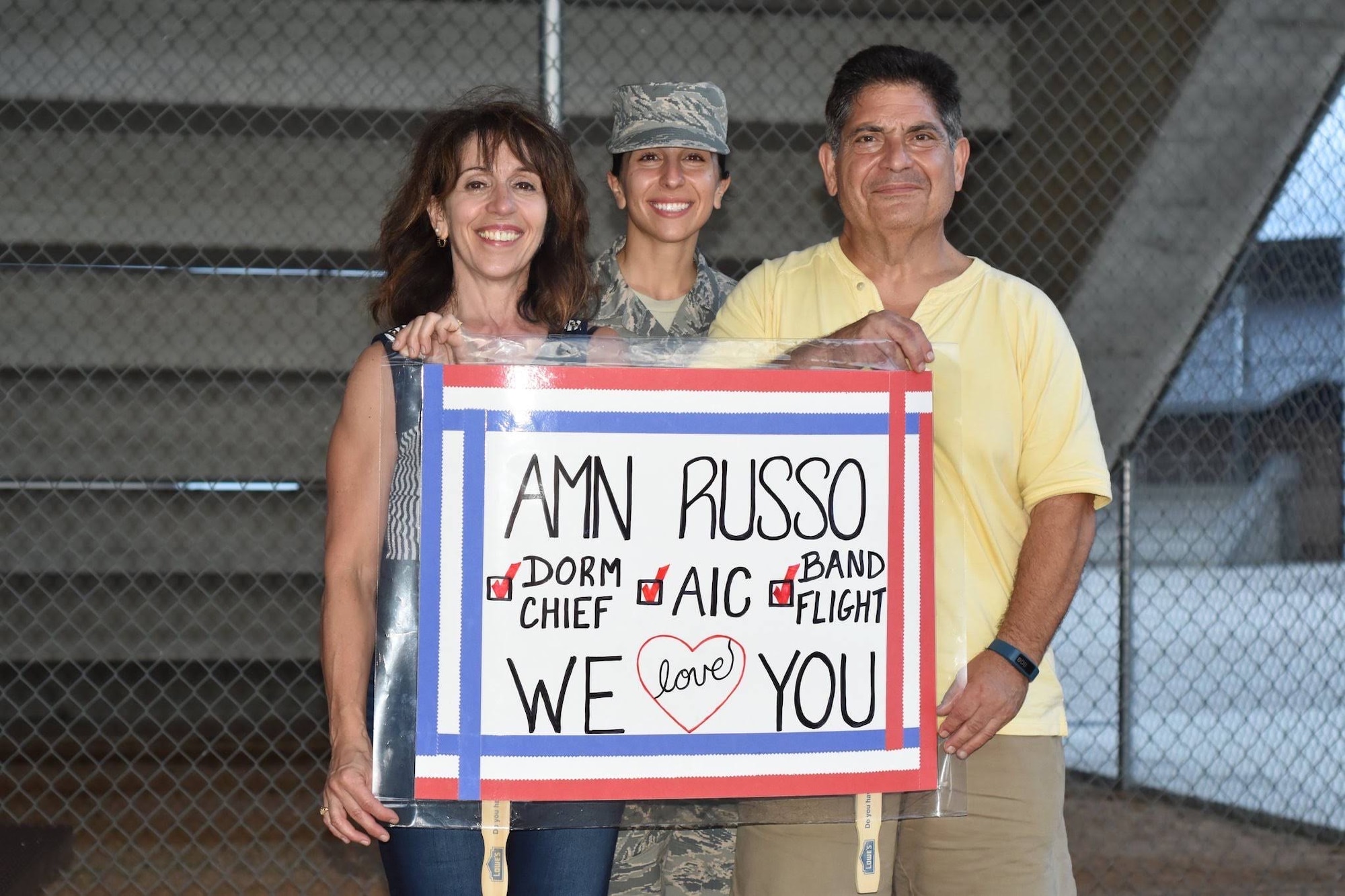 Airman 1st Class Christina Russo, a Basic Military Training graduate, poses for a photo with her parents, Carmen and Anna Marie Russo, after BMT graduation on Sept. 20, 2018, at Joint Base San Antonio-Lackland Air Force Base. Both of Russo’s parents served in the Air Force Reserve and returned to Lackland over 30 years later to watch their daughter graduate BMT.