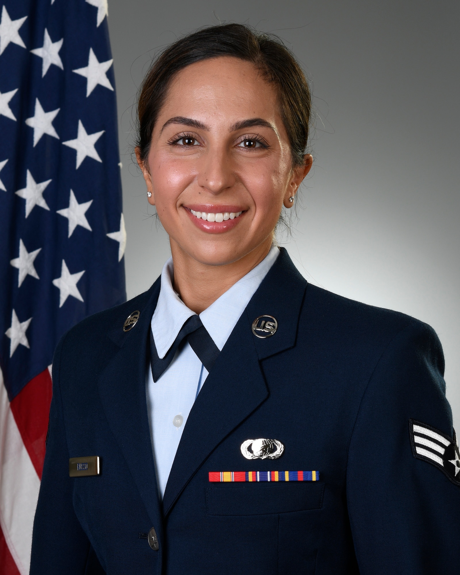 Senior Airman Christina Russo, a public affairs specialist with the 910th Airlift Wing, poses for her official photo on Aug. 13, 2019, at Youngstown Air Reserve Station. Russo is the daughter of Carmen and Anna Marie Russo, both of which served in the Air Force Reserve as a loadmaster and administrative assistant.