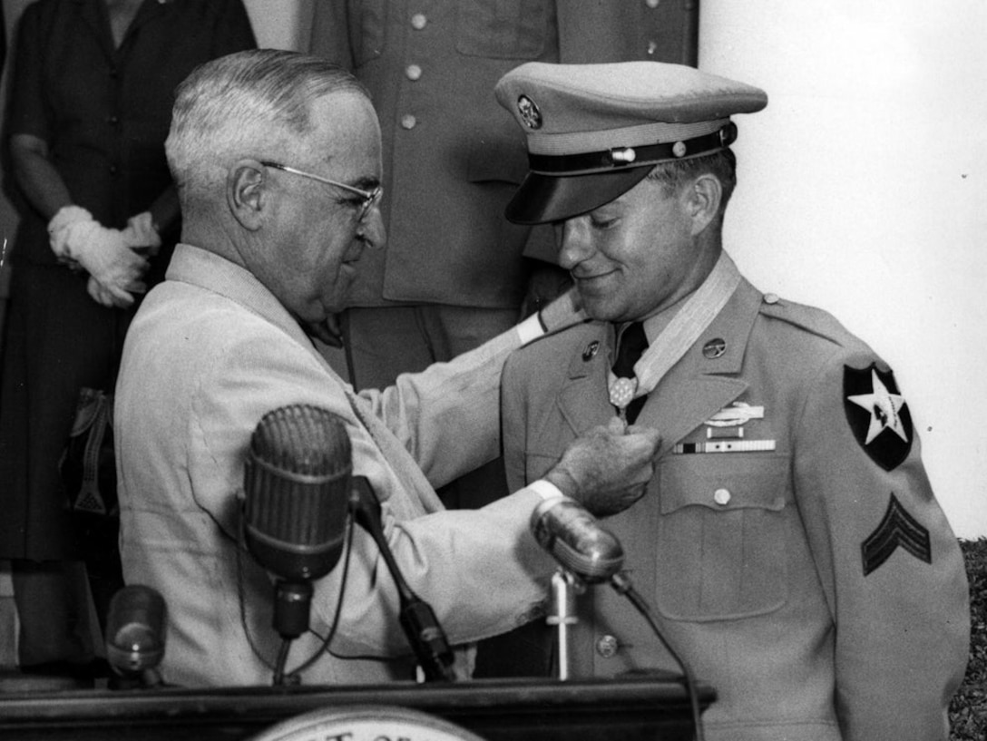 President Harry S. Truman presents the Medal of Honor to Army Cpl. Ronald Rosser.