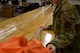 A photo of an Airman inspecting a parachute