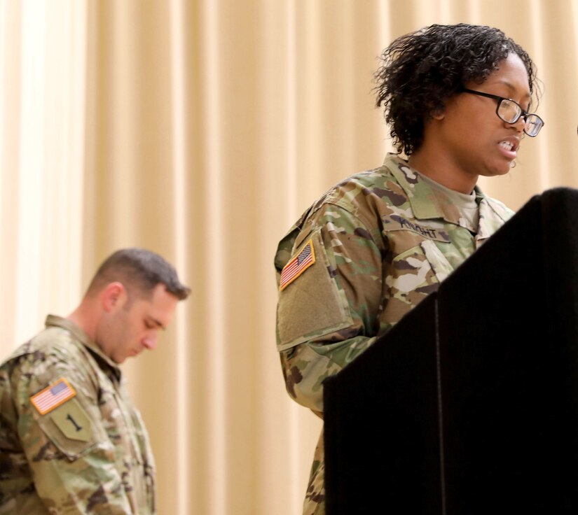 Sgt. Corrina Knight, a Soldier assigned to Madigan Army Medical Center, Joint Base Lewis-McChord, Wash., gives the benediction at the Non-commissioned Officer induction ceremony, Aug. 7, 2020. (Photo Credit: Christopher Larsen)