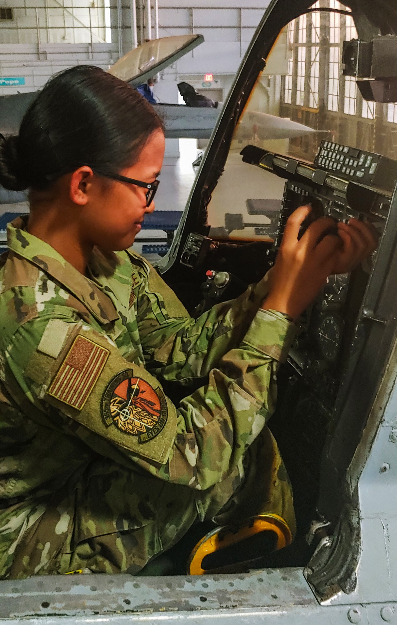 A1C Angelica Aquino works on an A-10 instrument panel