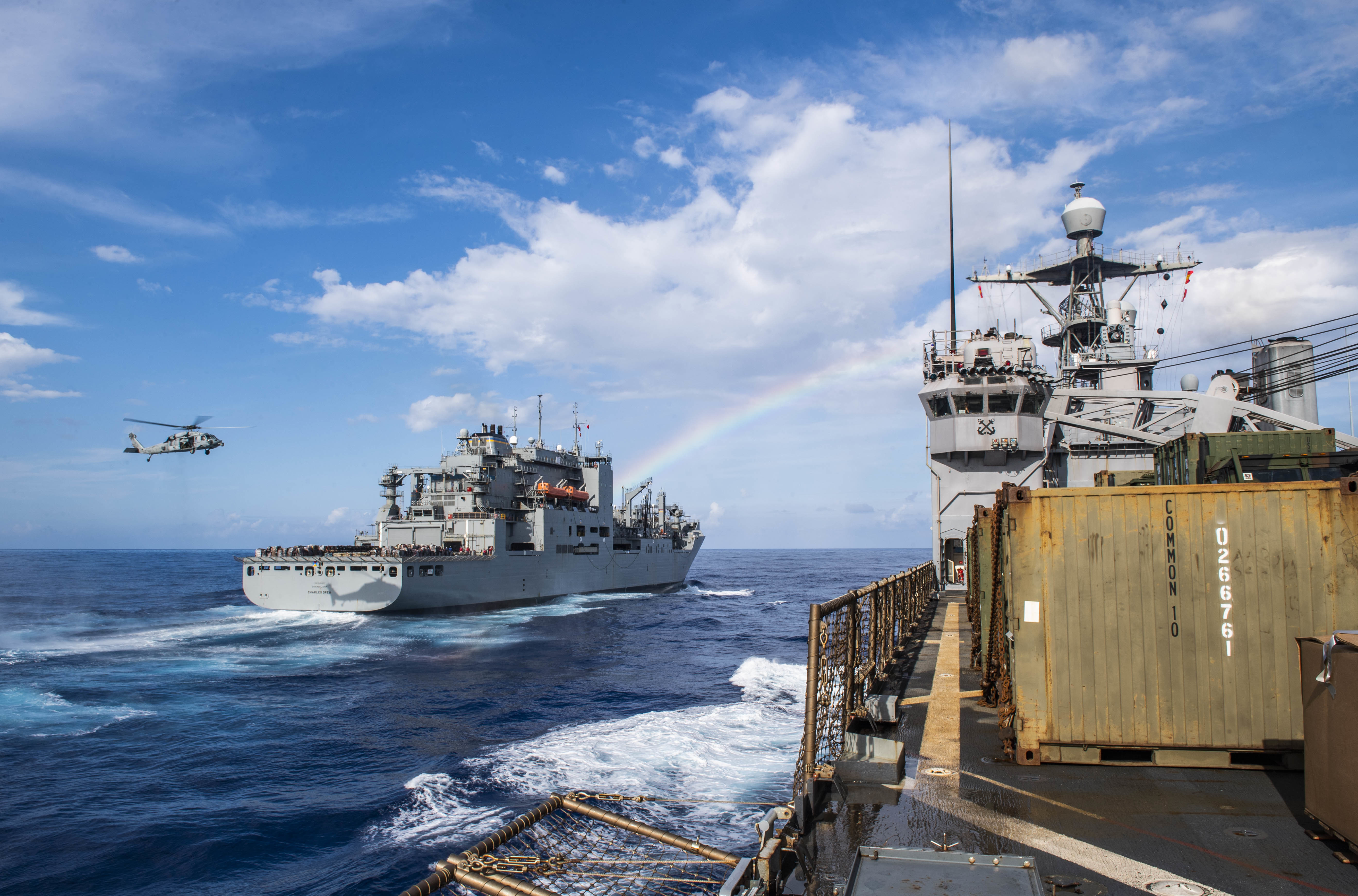 The amphibious dock landing ship USS Germantown (LSD 42), right, conducts a replenishment-at-sea with the dry cargo and ammunition  ship USNS Charles Drew (T-AKE 10).