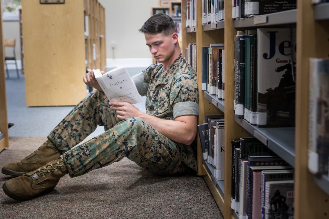 U.S. Marine Corps Sgt. Nikita Chesnokov, a legal services specialist assigned to Headquarters and Headquarters Squadron, reads a book in the Cherry Point Library at Marine Corps Air Station Cherry Point, North Carolina, July 10, 2019. Chesnokov uses his extra time to read a book from the Commandant’s reading list to not only improve his knowledge, but learn different ways to become a better leader for his Marines. (U.S. Marine Corps photo by Lance Cpl. Alexandra Amor Santos Arambulo)