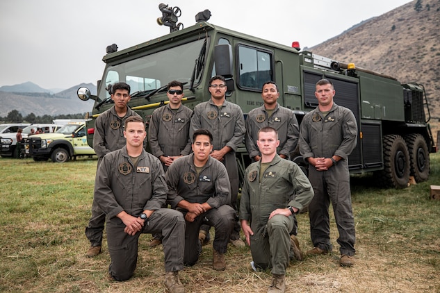 U.S. Marine Corps Crash Fire Rescue personnel pose for a photo at an Interagency improvised helicopter airfield near Coleville, Calif., Sept. 6.