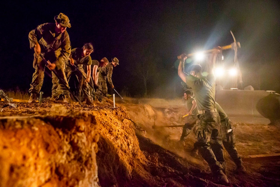U.S. Marines dig in preparation for a bridge during a Humanitarian Assistance/Disaster Relief scenario at Mount Bundey Training Area, Australia, Sept. 5.