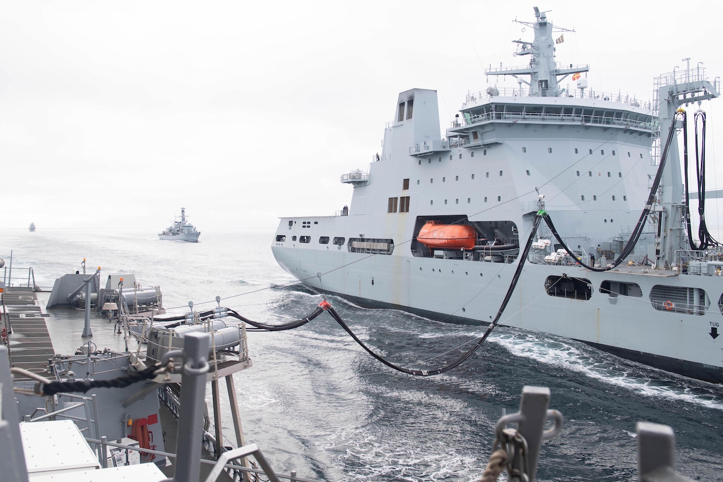 The Arleigh-Burke class guided-missile destroyer USS Ross (DDG 71) receives a fuel probe from British Royal Fleet Auxiliary RFA Tidespring (A136) Tide-class replenishment tanker, Sept. 5, 2020.