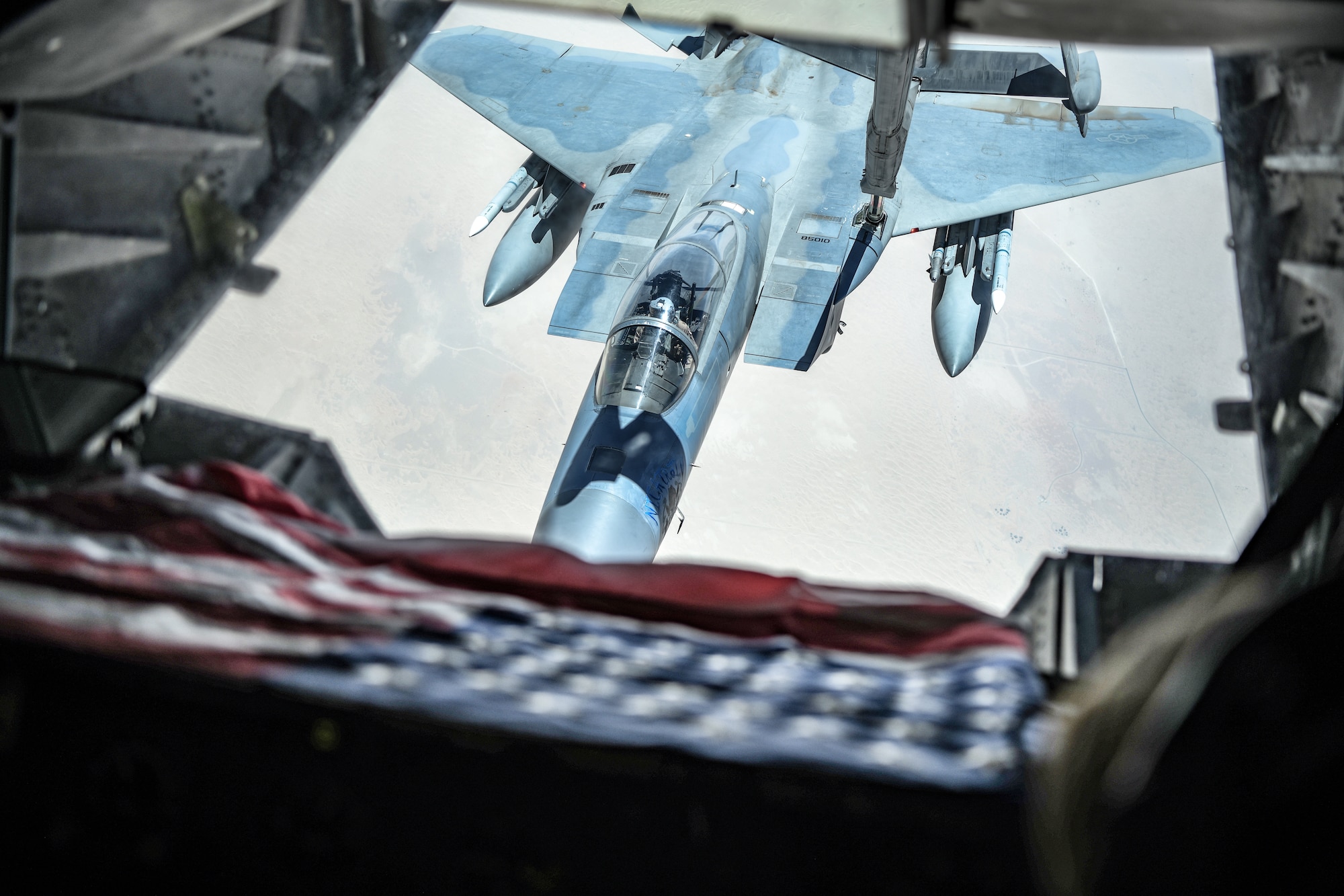 An U.S. F-15C from Prince Sultan Air Base, Kingdom of Saudi Arabia connects to the boom of a KC-10 Extender from the 908th Expeditionary Air Refueling Squadron during a large force employment, Aug. 25, 2020, at Al Dhafra Air Base, United Arab Emirates.