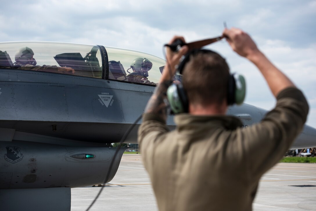 A U.S. F-16 Fighting Falcon, assigned to the 510th Fighter Squadron, Aviano Air Base, Italy, waits for completion of pre-flight checks at Royal Air Force Lakenheath, England, Sept. 2, 2020. The 510th FS is conducting close air support training with the 321st Special Tactics Squadron, the 19th Regiment Royal Artillery, and the 2nd Air Support Operations Squadron to enhance combat capabilities in support of European theater operations. (U.S. Air Force photo by Airman 1st Class Jessi Monte)