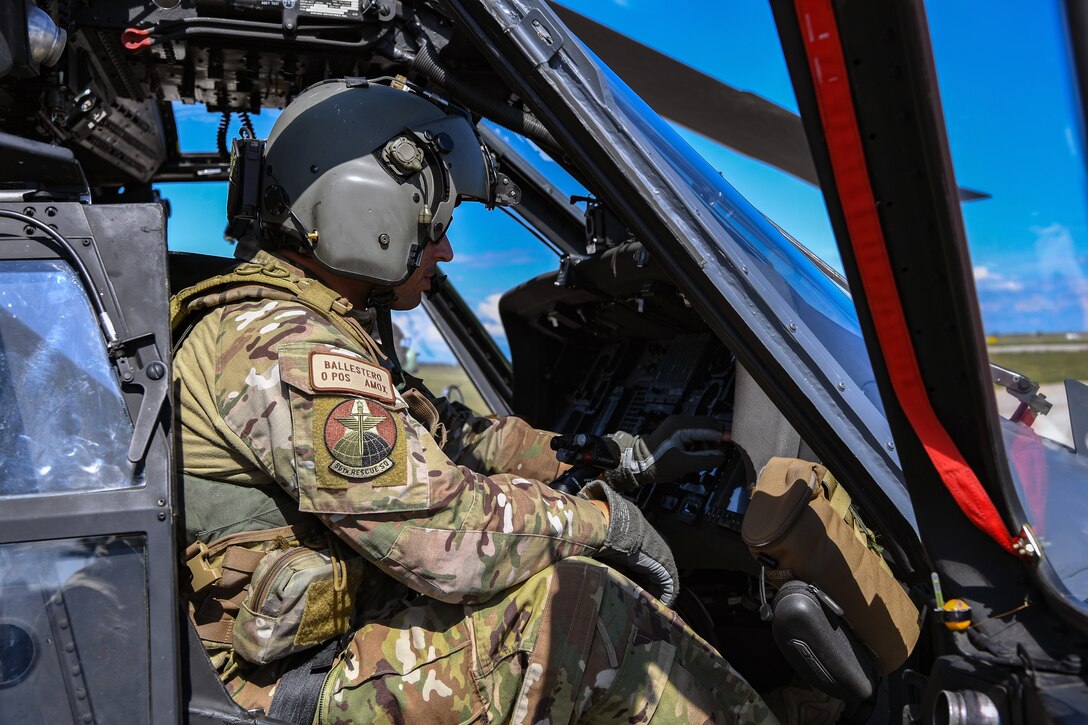 U.S. Air Force Lt. Col. Bryan D. Ballestero, 56th Rescue Squadron pilot, sits in a U.S. Air Force HH-60G Pave Hawk helicopter before a flight to Croatia at Aviano Air Base, Italy, Aug. 19, 2020. The 56th RQS flew to Croatia to train in a joint environment with the Croatian air force. The purpose of the training was to build proficiency in aerial gunnery for special mission aviators and joint integration for pilots. (U.S. Air Force photo by Airman 1st Class Thomas S. Keisler IV)